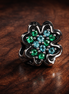 Splittable Four Leaf Clover Charm — display on walnut
