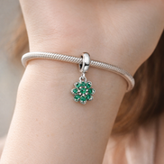Four Leaf Clover Dangle Charm — worn on wrist