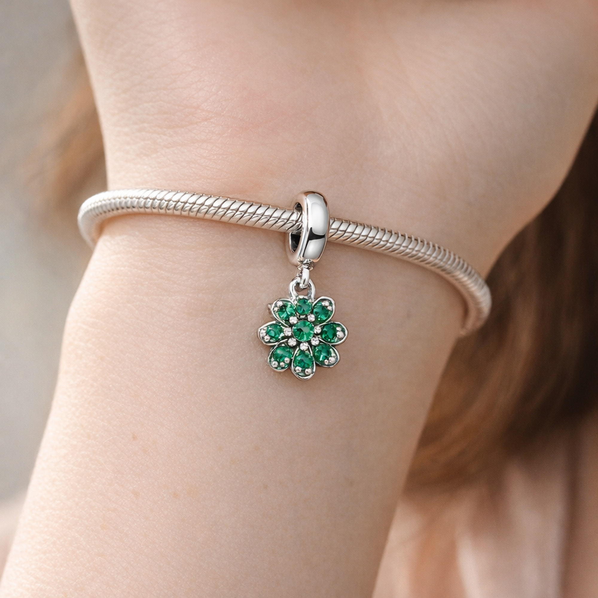 Four Leaf Clover Dangle Charm — worn on wrist