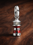 Glow-in-the-dark Lighthouse Dangle Charm — display on walnut