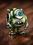 Mike Wazowski Charm - Green One-Eyed Monster Charm — display on walnut
