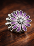 Purple Daisy Bloom - Purple Daisy Bloom Charm — display on walnut