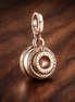 Rose Gold Plated Double Ring Charm - Rose Gold Plated Double Circle Dangle Charm — display on walnut