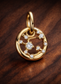 Taurus Zodiac Charm - Gold Plated Taurus Zodiac Charm — display on walnut