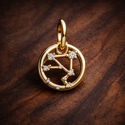 Libra Zodiac Charm - Gold Plated Libra Zodiac Charm — display on walnut