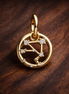 Libra Zodiac Charm - Gold Plated Libra Zodiac Charm — display on walnut