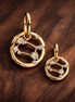 Cancer Zodiac Charm - Gold Plated Cancer Zodiac Charm — display on walnut