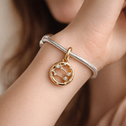 Cancer Zodiac Charm - Gold Plated Cancer Zodiac Charm — worn on wrist