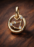 Aquarius Zodiac Charm - Gold Plated Aquarius Zodiac Charm — display on walnut
