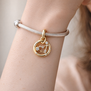 Aquarius Zodiac Charm - Gold Plated Aquarius Zodiac Charm — worn on wrist