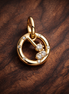 Gemini Zodiac Charm - Gold Plated Gemini Zodiac Charm — display on walnut