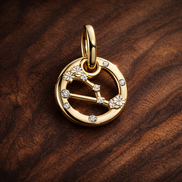 Scorpio Zodiac Charm - Gold Plated Scorpio Zodiac Charm — display on walnut