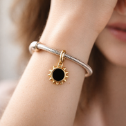 Gold Plated Sun Outline Charm - Gold Plated Open Sun Dangle Charm — worn on wrist