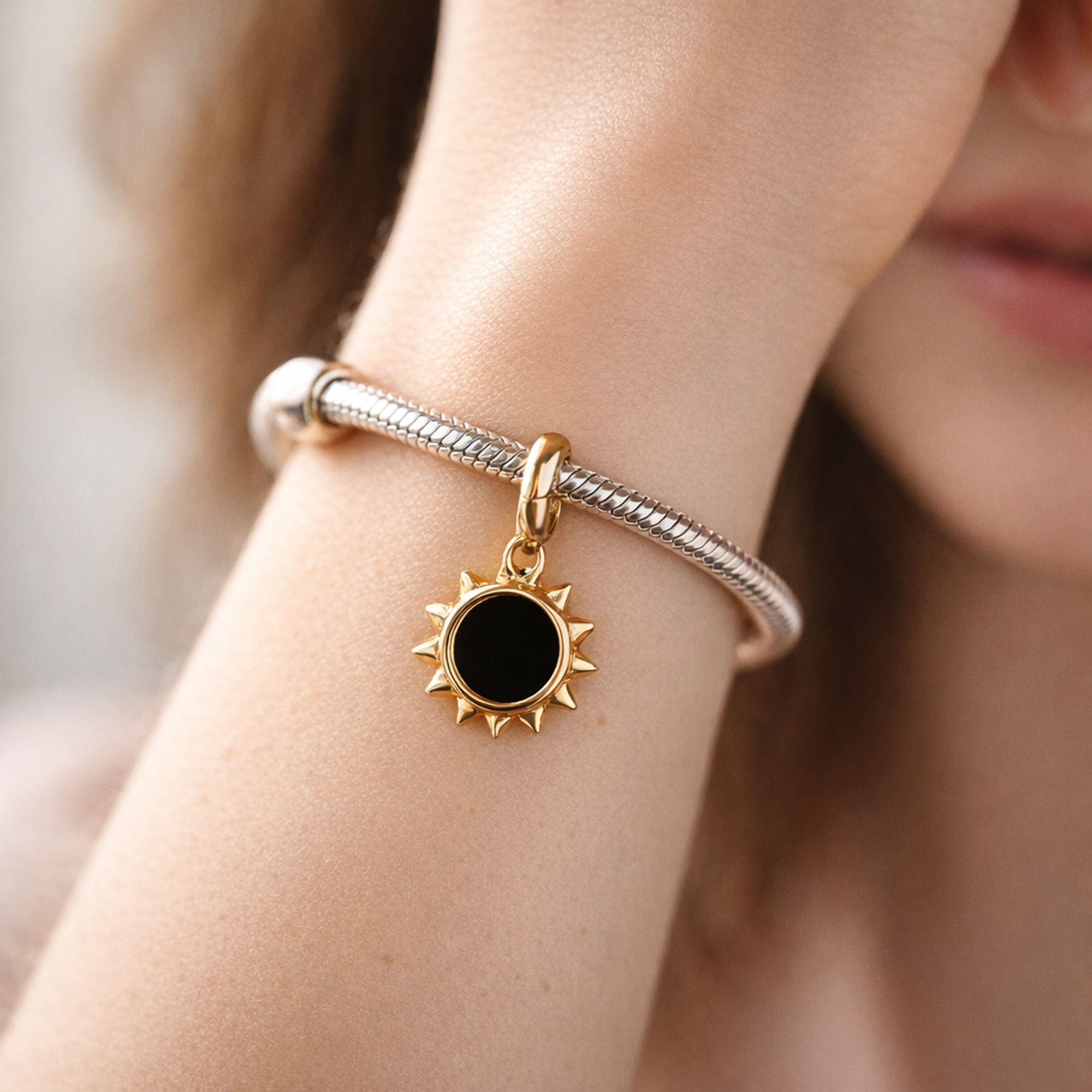 Gold Plated Sun Outline Charm - Gold Plated Open Sun Dangle Charm — worn on wrist