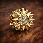 Gold Plated Sunflower Pavé Charm - Gold Plated Sunburst Crystal Charm — display on walnut