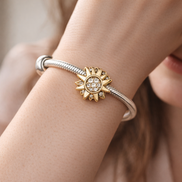 Gold Plated Sunflower Pavé Charm - Gold Plated Sunburst Crystal Charm — worn on wrist