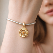 Game of Thrones Spinning Astrolabe Dangle Charm — worn on wrist