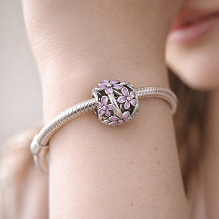 Openwork Purple Daisy Charm — worn on wrist