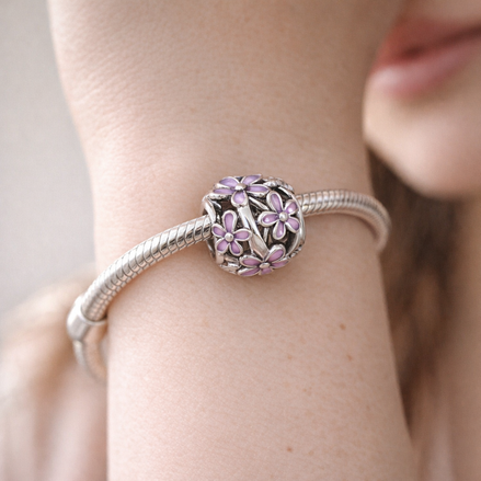 Openwork Purple Daisy Charm — worn on wrist