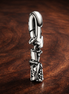 Silver Tie Charm - Silver Necktie Dangle Charm — display on walnut