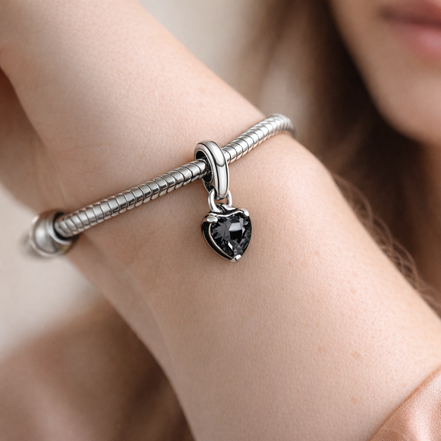 Pandora ME Black Chakra Heart Mini Dangle Charm — worn on wrist