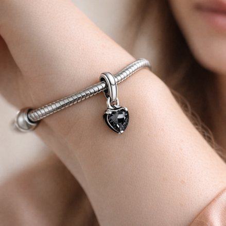 Pandora ME Black Chakra Heart Mini Dangle Charm — worn on wrist