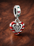 Double Candy Cane Heart Christmas Dangle Charm — display on walnut