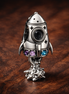 Space Love Rocket Charm — display on walnut