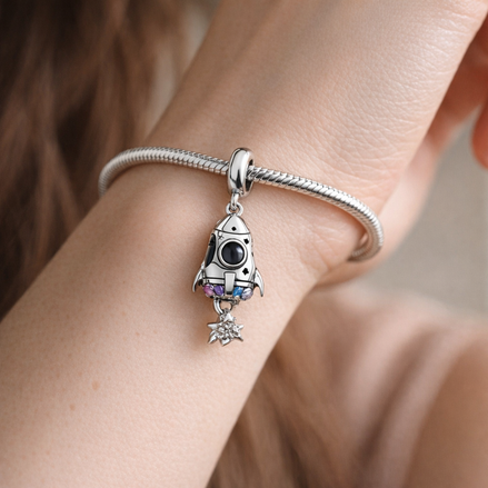 Space Love Rocket Charm — worn on wrist