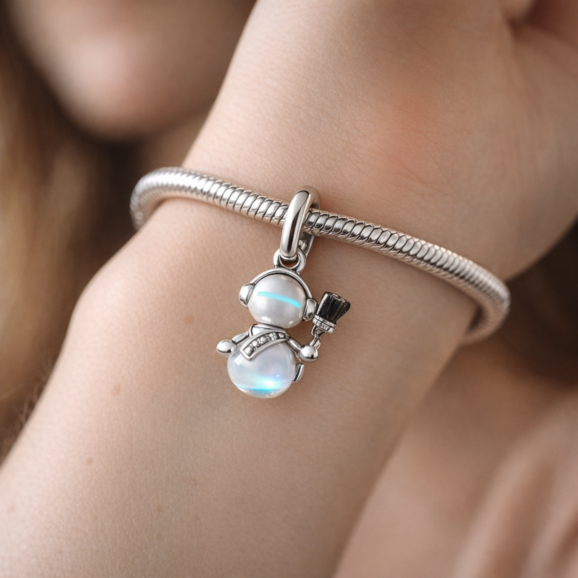 Opalescent Snowman Dangle Charm — worn on wrist