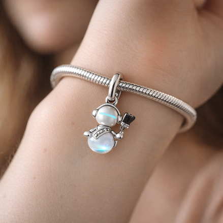 Opalescent Snowman Dangle Charm — worn on wrist