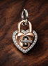 Heart Padlock Charm - Rose Gold Plated Heart Lock Charm — display on walnut