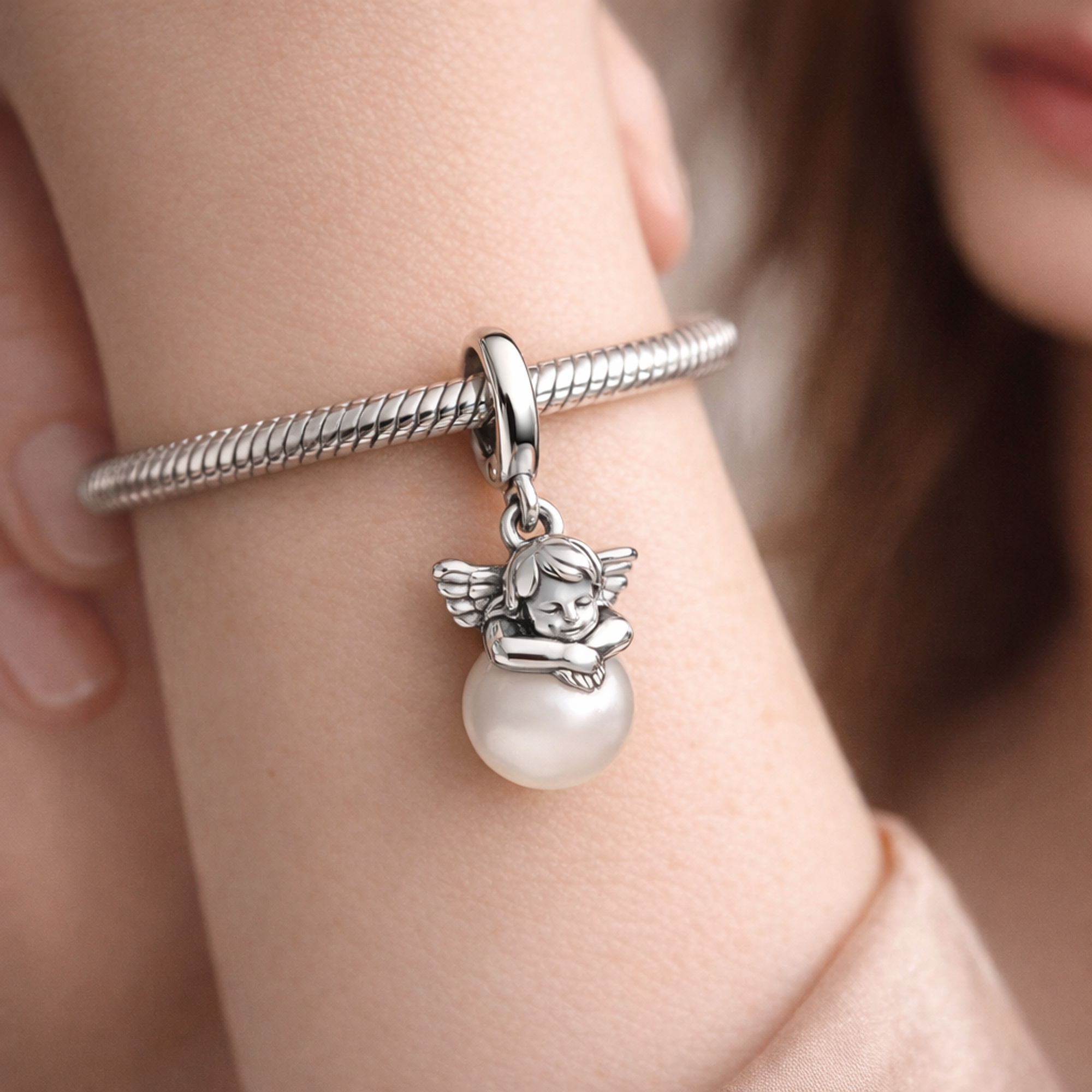 Pandora ME Cupid Mini Dangle Charm — worn on wrist