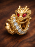 Dragon Charm — display on walnut