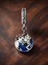 Blue Whale Tail Ocean Charm - Blue Ocean Whale Tail Dangle Charm — display on walnut