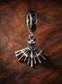 Eyelash Fan Charm - Silver Eye Fan Dangle Charm — display on walnut
