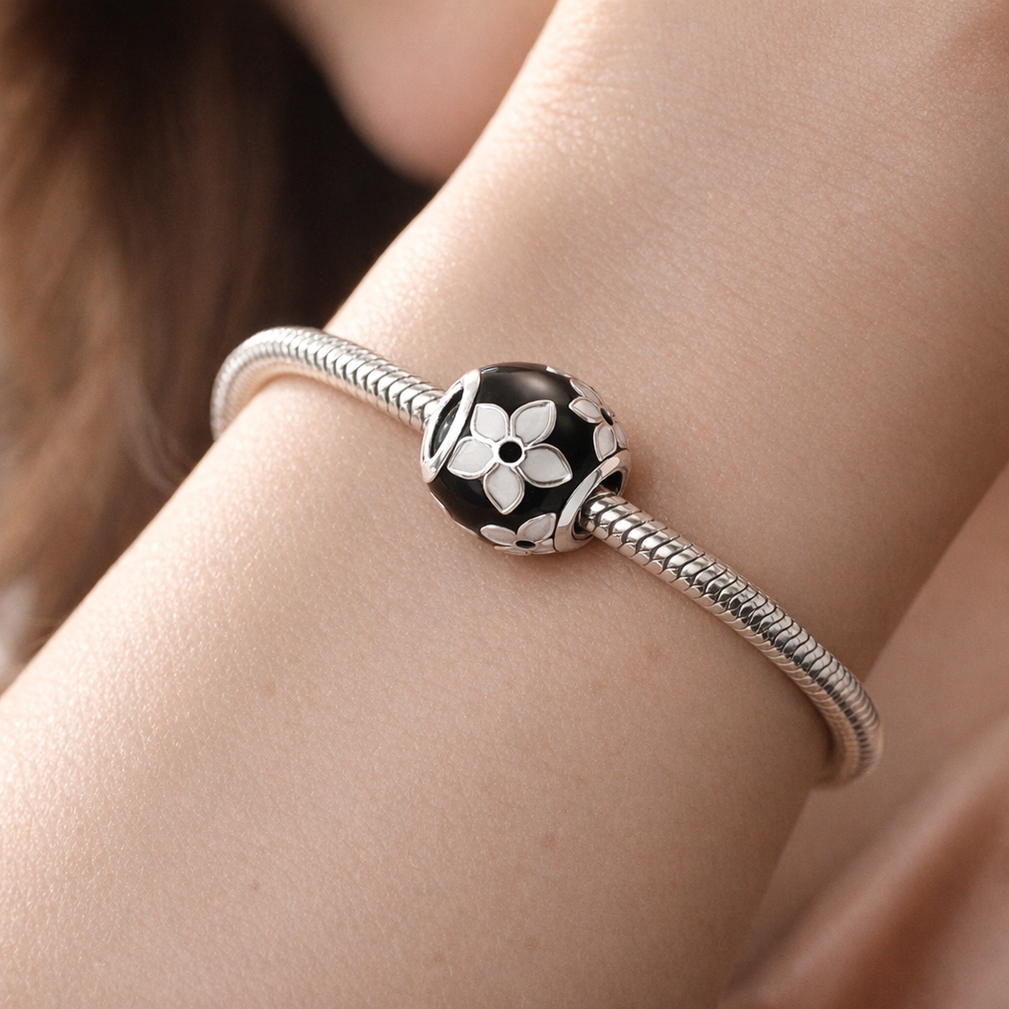 Black White Flower Bead - Black and White Floral Bead Charm — worn on wrist