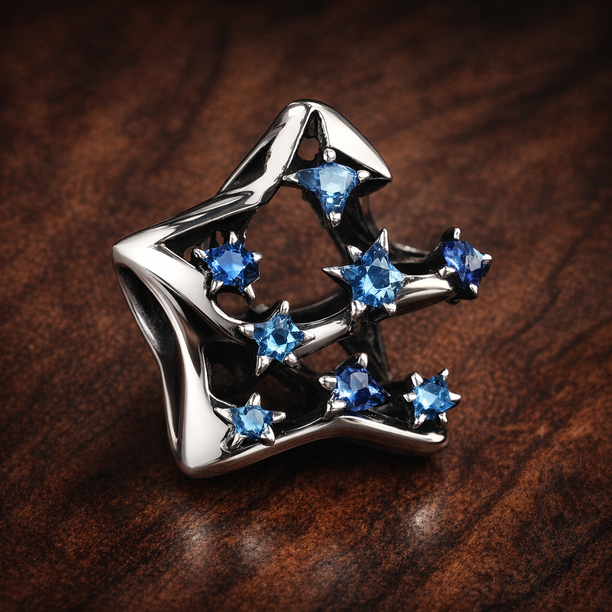 Bold Sparkling Star Charm — display on walnut