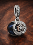 Two-tone Shooting Star Double Dangle Charm — display on walnut