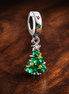 Sparkling Christmas Tree Dangle Charm — display on walnut