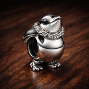 Skiing Penguin Charm - ZZ1552_2 — display on walnut