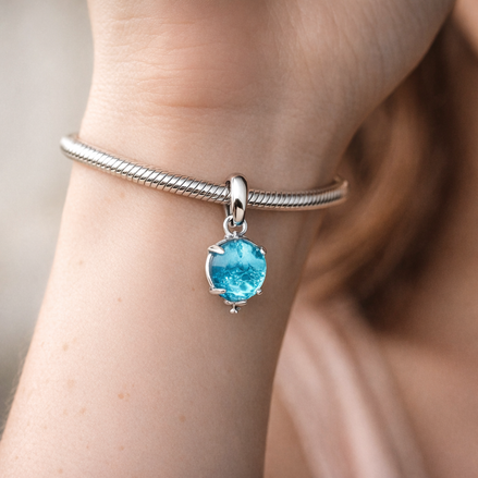Blue Murano Glass Balloon Dangle Charm — worn on wrist