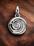 Silver Spiral Charm - Silver Spiral Galaxy Dangle Charm — display on walnut