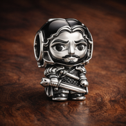 Game of Thrones Jon Snow Charm — display on walnut