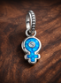Female Symbol Evil Eye Charm - Blue Evil Eye Female Symbol Charm — display on walnut