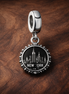 New York Skyline Apple Charm - New York Skyline Apple Charm — display on walnut