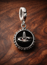 Compass Travel Dangle Charm - Compass Travel Dangle Charm — display on walnut