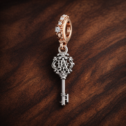 Storybook Key and Balloon Charm - Storybook Key and Balloon Charm — display on walnut