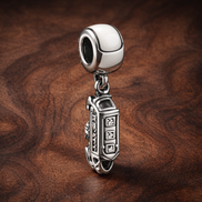 London Landmark Dangle Charm - London Landmark Dangle Charm — display on walnut