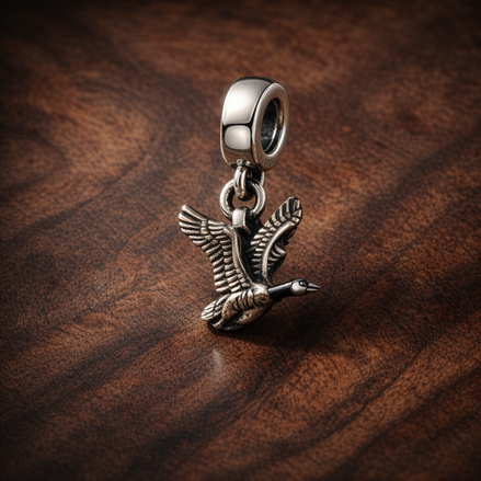 Hummingbird and Butterfly Charm - Hummingbird and Butterfly Charm — display on walnut